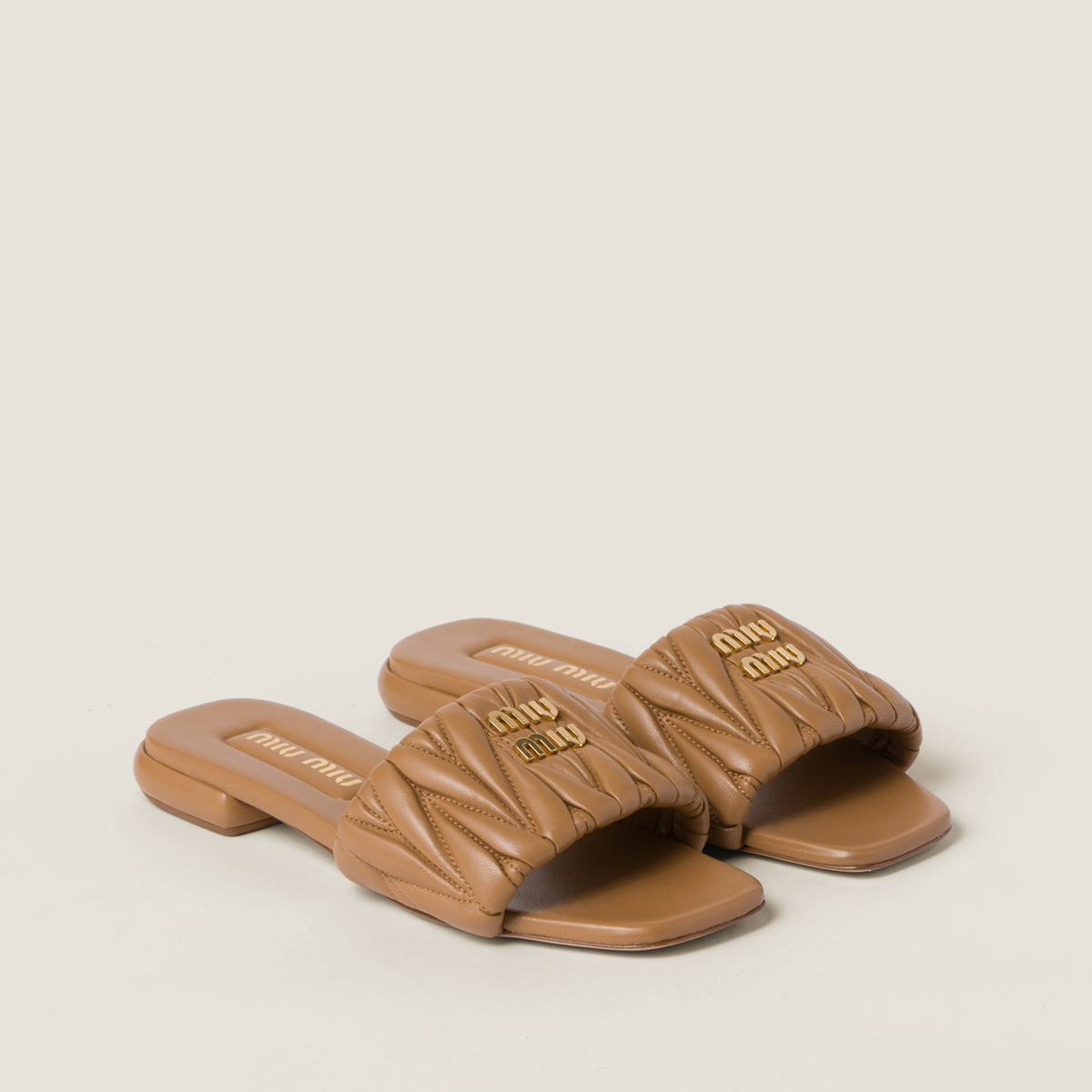 Miu Miu Matelasse Nappa Leather Slides Caramel Miu Miu Matelasse Nappa Leather Slides Caramel